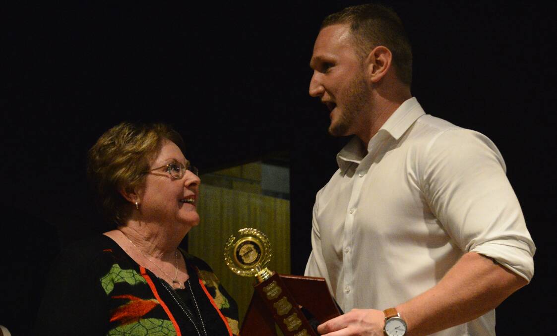TOP NIGHT: Carol Wolinski presents Greg Anderson with the John Wolinski Memorial Supporters Club Most Consistant First Grade Player award. 
