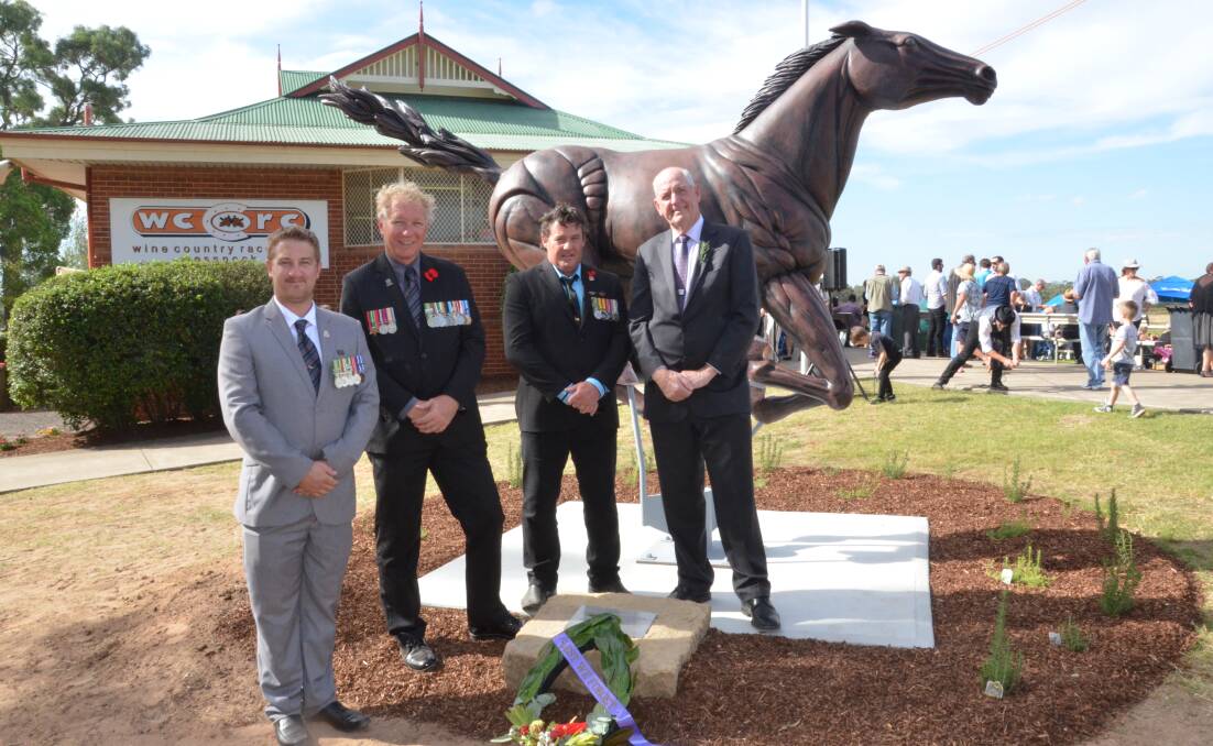 ANZAC DAY SUCCESS: Stewart Sherman, Dan Jeffery and Craig Blue, from Soldier On, and Newcastle Jockey Club chairman Geoff Barnett after the war horse statue was unveiled at Cessnock Racecourse. Picture: Krystal Sellars