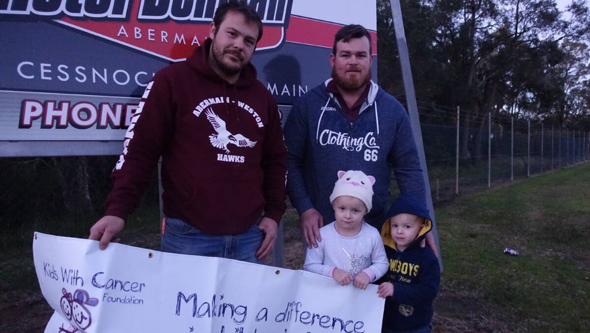 MAKE A DIFFERENCE: Abermain coach Dean Peterkin with forward Bryce Chapman and his children Marlie, 4, and Nash, 2. Picture: Michael Hartshorn