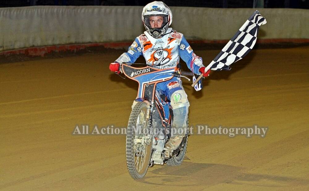 STATE CHAMPION: Rohan Tungate does a lap of honour with the checkered flag after winning the NSW Speedway Solo Championship. Picture: Paul Galloway.