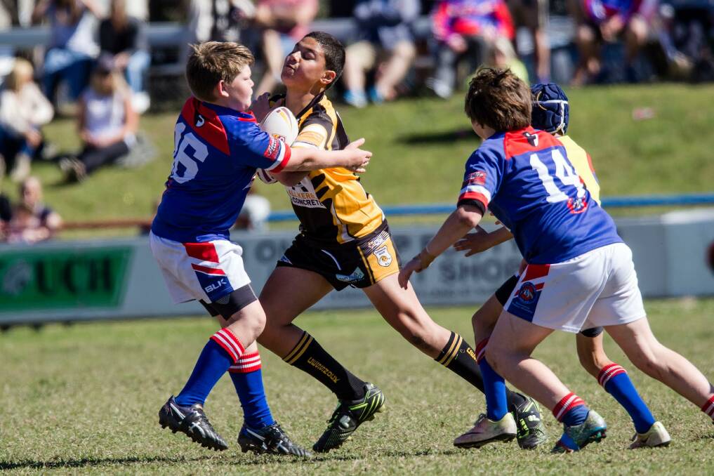 GRAND DAY: Cessnock's Nicholas Tuliatu takes on the Bulldogs defence in the Under11-1 division grand final. Picture: Kerensa Mitchell