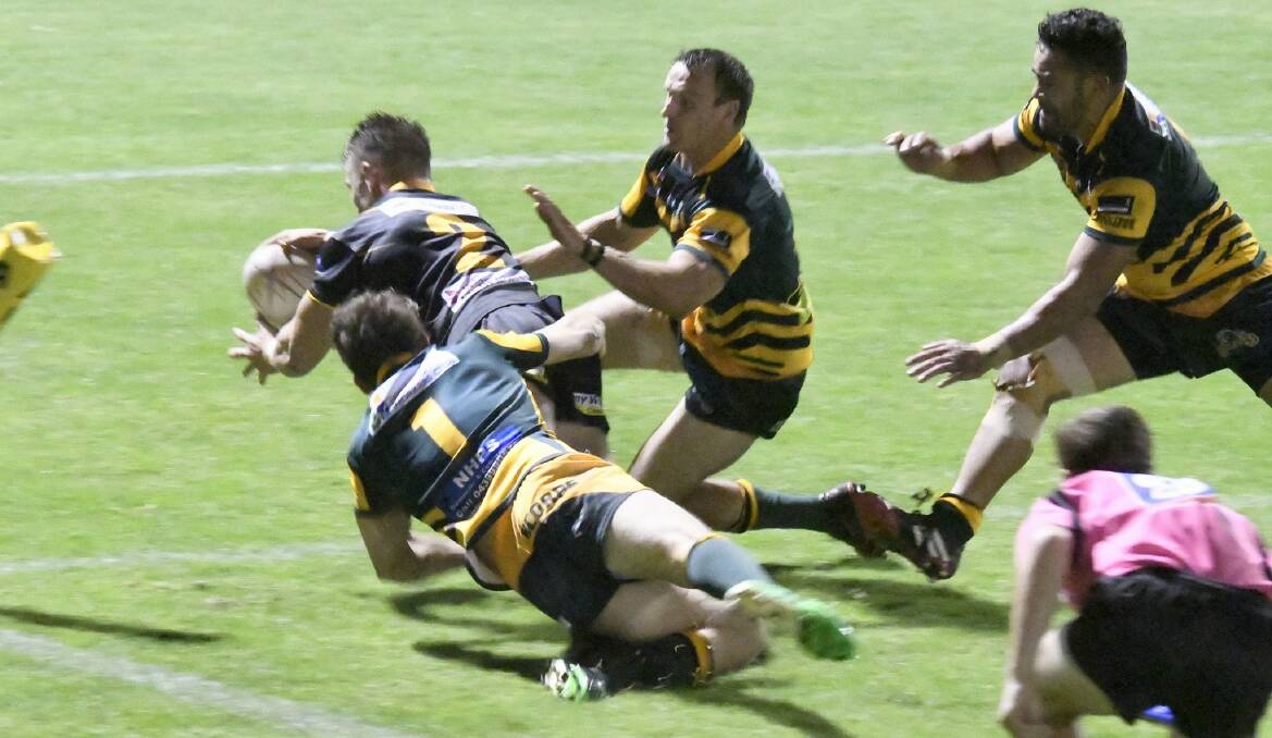 EXPERIENCE: Chris Pyne dives in for a try against Macquarie Scorpions on Saturday. Picture: Michael Hartshorn
