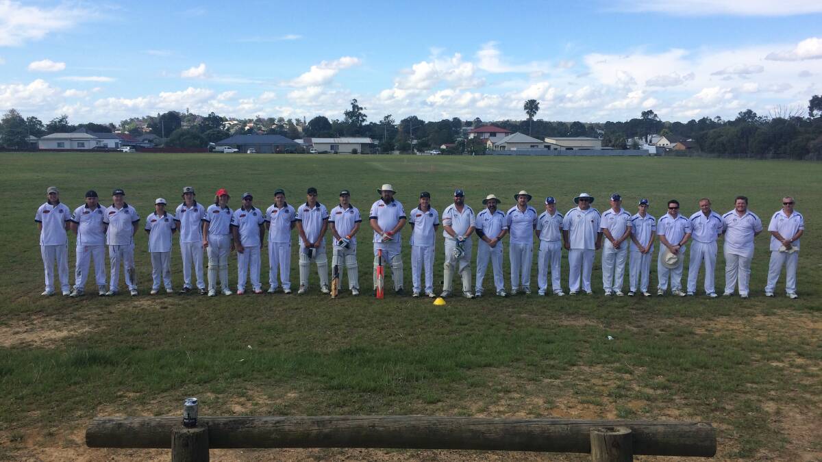 Denman Hotel third grade vs Greta/Branxton Blue observing a minute's silence for remembrance day.