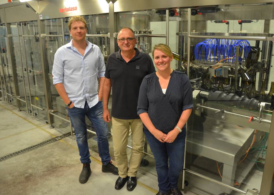 PROGRESSIVE: First Creek Wines chief operating officer Shaun Silkman, managing director Greg Silkman and chief winemaker Liz Silkman in front of the new bottling line. Picture: Krystal Sellars