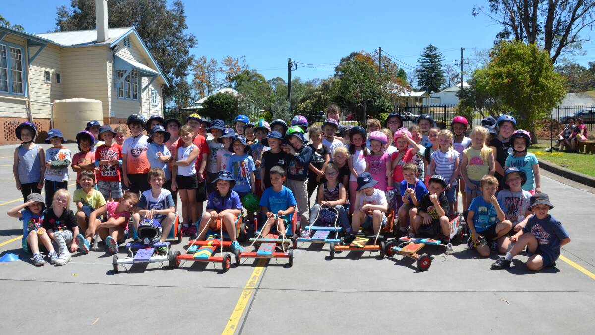 FUN DAY: Stage one students after the billy cart derby at Abermain Public School on Tuesday.