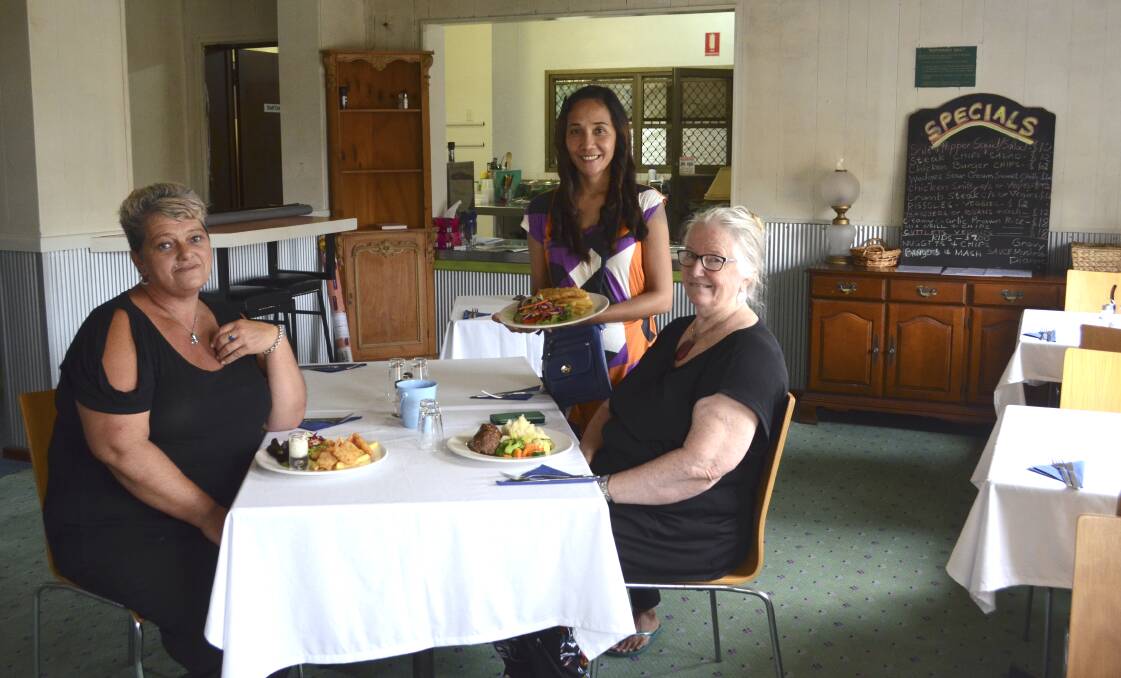 GIVING BACK: Murals Restaurant cook Sharon McCure and waitress Lenie Lalaguna Weir and Marli Accommodation Services CEO Liz Berger in the new cafe that is now open for business at the former Empire Tavern in Kurri Kurri.