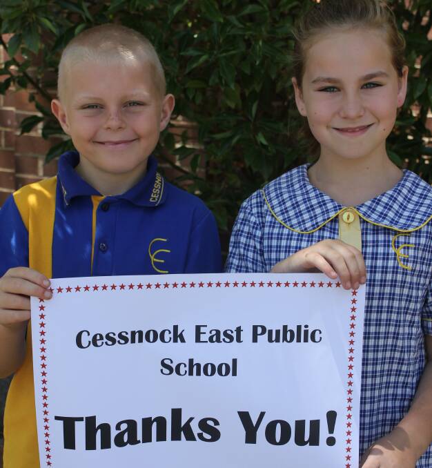 GRATEFUL: Cessnock East Public School students (like Barry and Danielle, pictured) say a big 'thank you' to the firefighters.