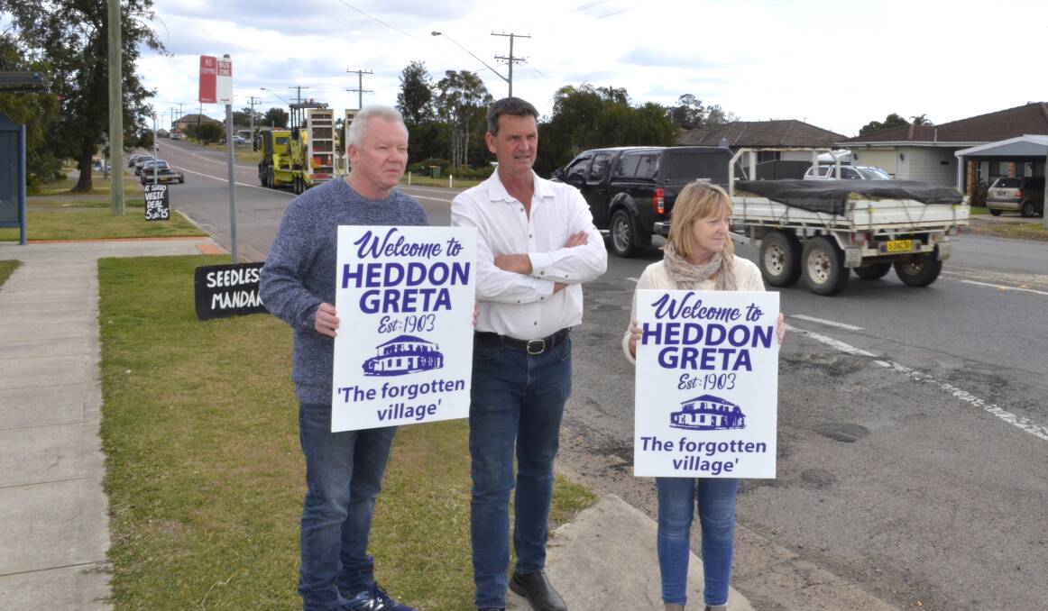 PROGRESS: Cessnock councillor Darrin Gray (centre) with Heddon Greta Residents Action Group members Steve Gilbey and Kim Newton on Main Road on Monday afternoon. Picture: Krystal Sellars