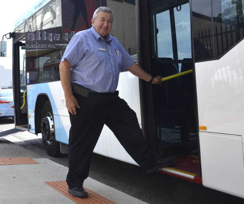 MODERN: Rover Coaches work health and safety manager Richard Ingall steps onto the centre-door bus. Picture: Krystal Sellars