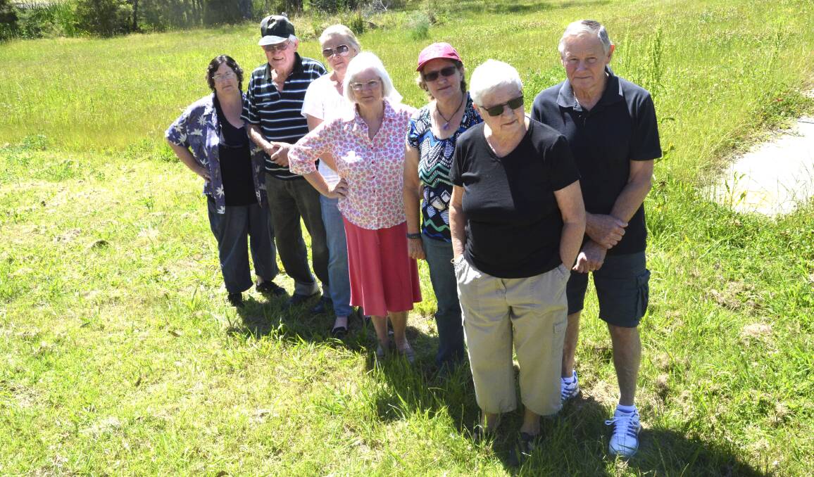 LONG WAIT AHEAD: North Rothbury residents Karen Chandler, Darrell Willson, Anna Slater, Bev Nugent, Patricia Ables, Robyn Talbot and Ian Talbot.