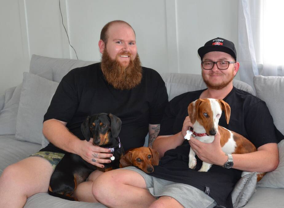 HAPPY: Cessnock couple Brendan Peel and Brett King, pictured with their dogs Slinky, Sizzle and Sooty, are thrilled with the result of the marriage equality survey. Picture: Krystal Sellars