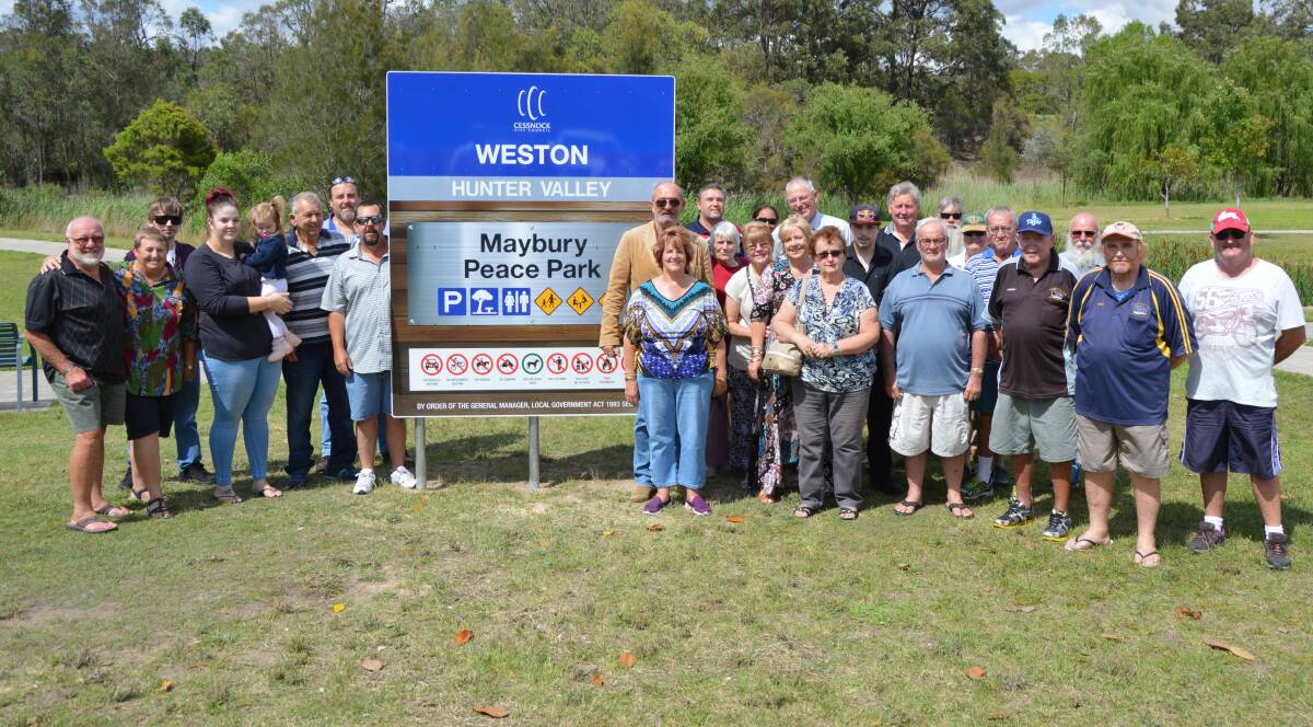 HONOURED: Family and friends of the late Jeff Maybury gathered at Peace Park on Wednesday for the unveiling of signage revealing the park's new name.