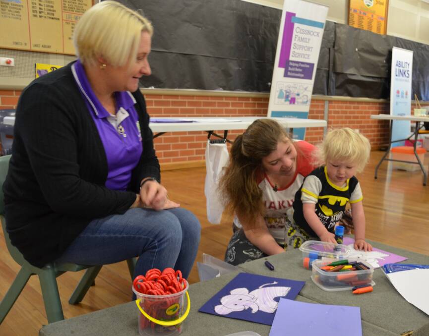 FRIENDLY ATMOSPHERE: Family Insight family support worker Melinda Krieger and Jasmine Hawkins and her son Jonnah, 19 months, at the Play2Learn open day.
