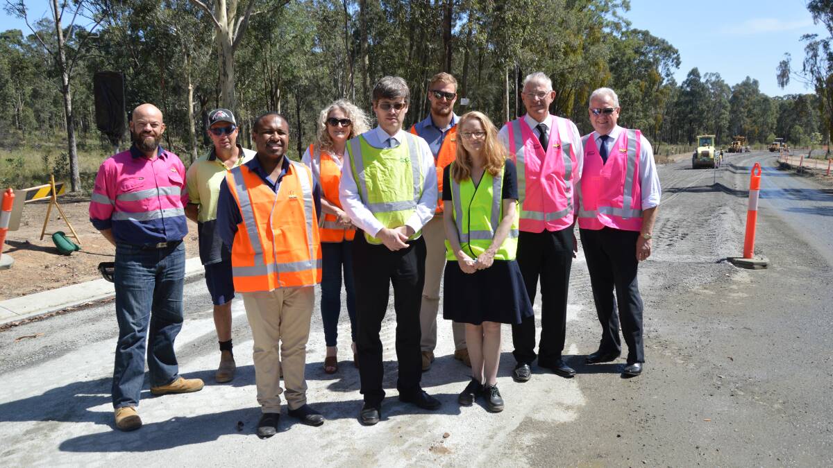UPGRADE: Representatives of Cessnock City Council, Singleton Shire Council and Pokolbin businesses at the site of the Hermitage Road works on Tuesday. Picture: Cessnock City Council