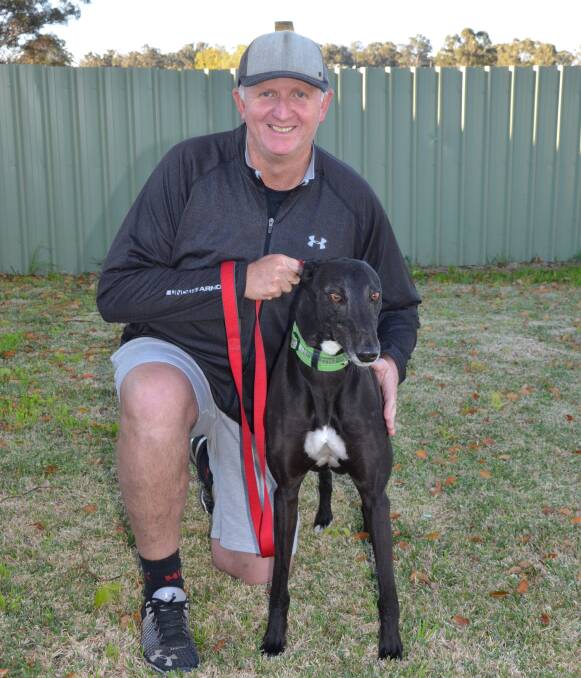 GOOD COMPANION: Cessnock resident Troy McCord and his greyhound Sonny, whom he adopted through the Greyhounds As Pets organisation. Picture: KRYSTAL SELLARS