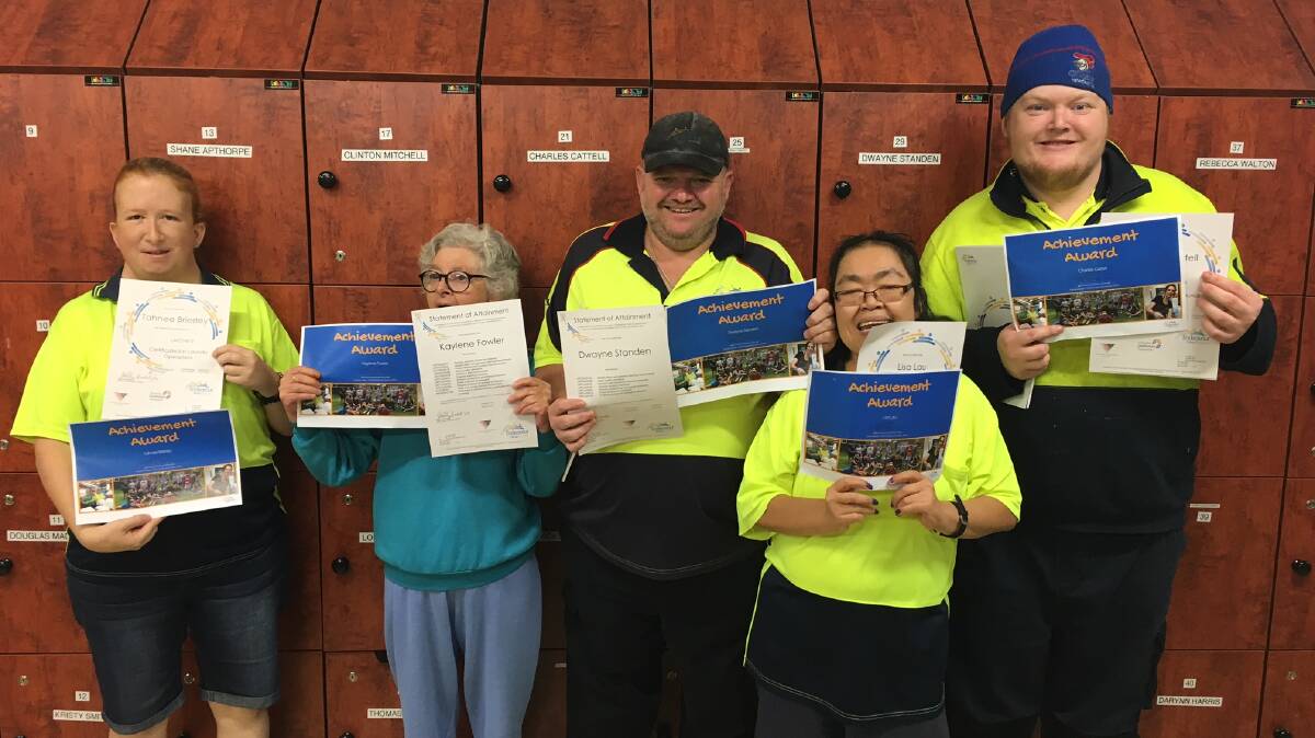 QUALIFICATION: Endeavour Group Australia Cessnock supported employees Tahnee Brierley, Kaylene Fowler, Dwayne Standen, Lisa Lau and Charles Cattell with their certificates.