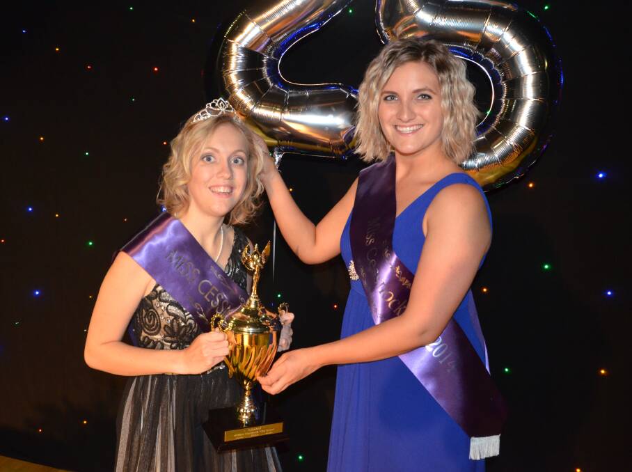 CROWN: Miss Cessnock City 2015 Emma Myers is crowned by 2014 winner Cassandra Battle. The quest returns this year after a one-year hiatus. Picture: Sage Swinton
