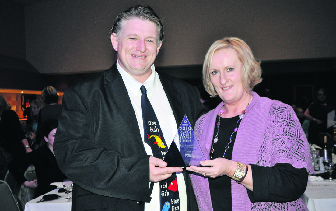 2010: Matthew Parkins of Joblink Plus presents overall winner Julie Carmichael with her award.