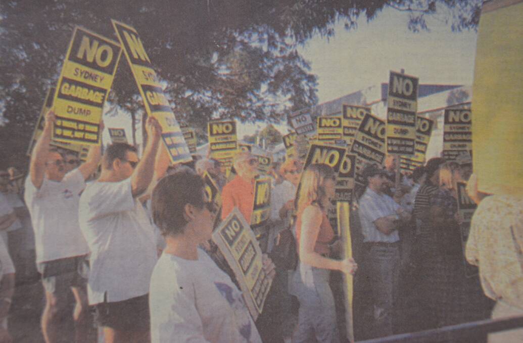 FLASHBACK: Pictured on the front page of the Advertiser on March 4, 1998, part of the big crowd that turned out to protest the waste management centre briefing session at Cessnock Council chambers. Picture: Jane Parsons