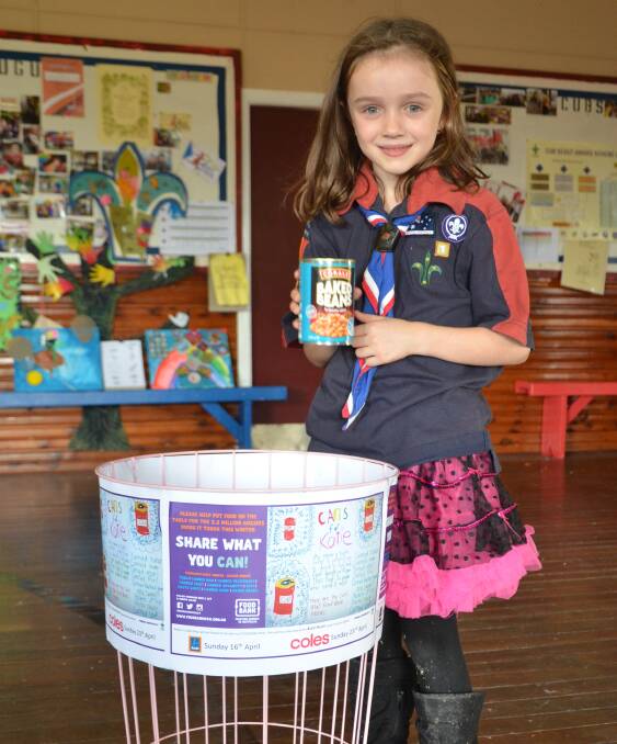 FOOD DRIVE: Katie Martin, 7, is collecting cans for Foodbank for her Joey Scouts 'Promise Challenge' badge. Picture: Krystal Sellars