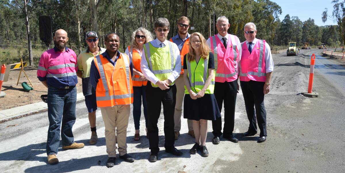 UPGRADE: Representatives of Cessnock City Council, Singleton Shire Council and Pokolbin businesses at the site of the Hermitage Road works on Tuesday. Picture: Cessnock City Council
