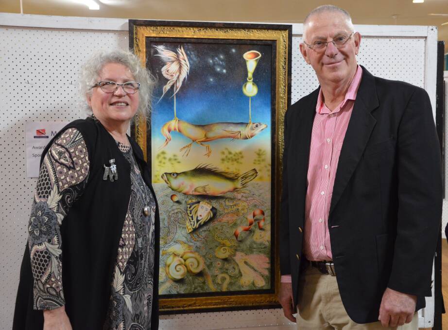 THRILLED: Major prize winner Susan Ryman, of Coal Point, and Cessnock Mayor Bob Pynsent at the Weston Art Show opening night on June 21, 2016. Picture: KRYSTAL SELLARS
