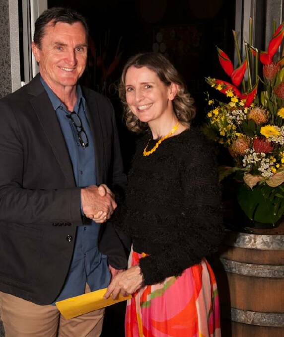 WINNER: Alan Jurd of Jurds Real Estate presents Cessnock Regional Art Gallery Spring Art Fair winner Michèle Heibel with her prize. Picture: Peter McNeill, Natural Lightscapes Photography