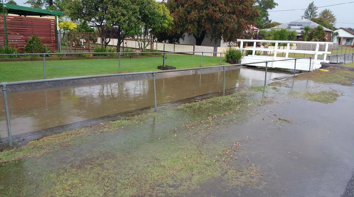 OVERFLOWING: The Oliver Street drain after a flash flood in October 2015. Picture: Matt McIntyre. 