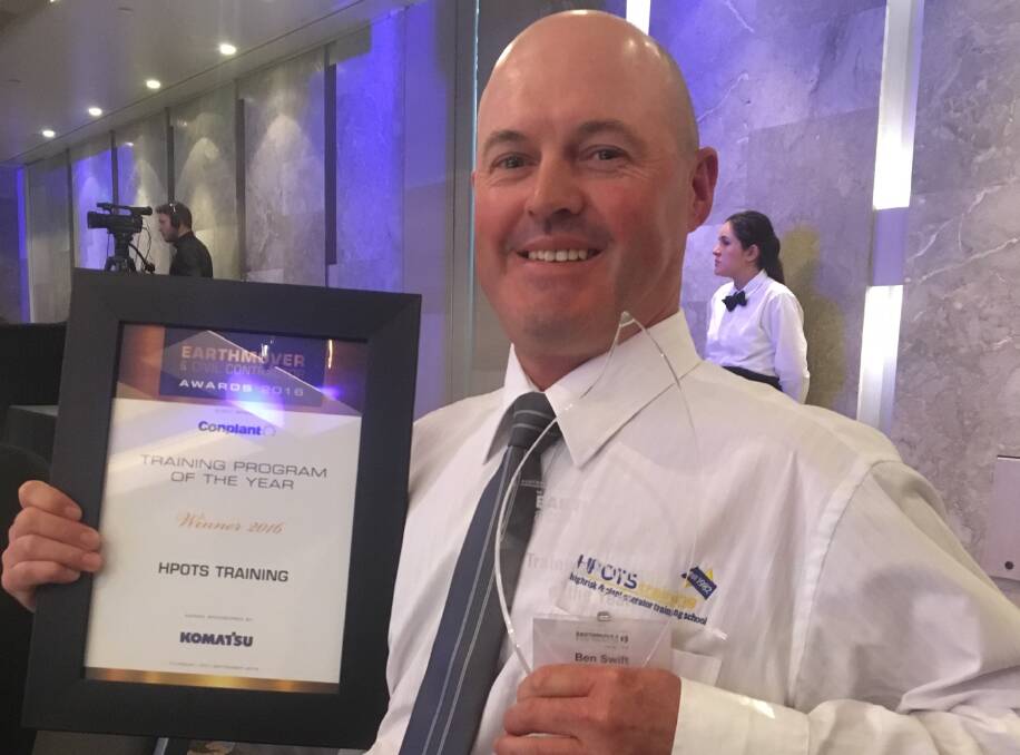 HONOUR: HPOTS training and development manager Ben Swift with the training school's award at the Earthmover and Civil Contractor awards.