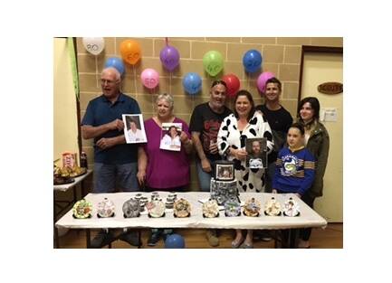 MILESTONE YEAR: Family members who celebrated their 'decade' birthdays this year, holding photos of those who weren't able to attend.
