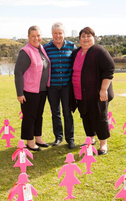 MAKING A DIFFERENCE: Raelene Boyle (centre) with Cessnock Breast Cancer Support Group members Katrina Richardson and Kellie Jurd at the BCNA Summit in 2013.