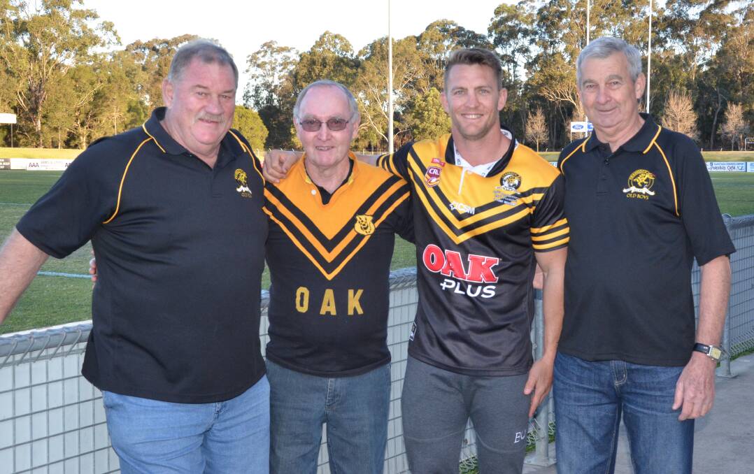 MEMORIES: Cessnock Goannas 1977 premiership players Bob Everson, John Fairns (wearing an original '77 jersey) and Mick Goldman with current player Chris Pyne in the replica jersey the Goannas will wear this weekend. Picture: Krystal Sellars