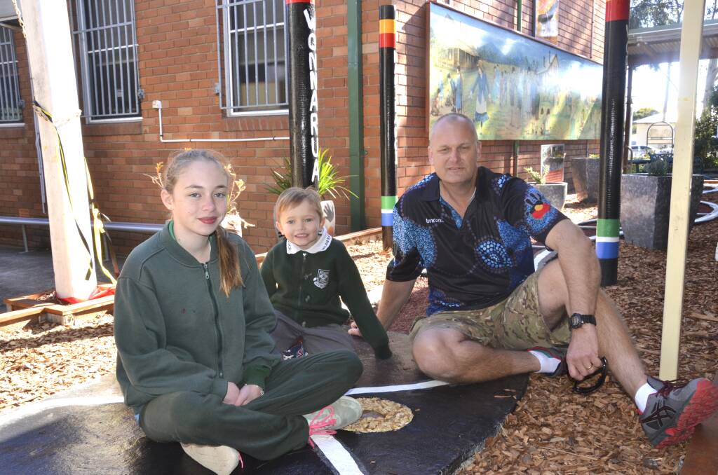 SPECIAL PLACE: Branxton Public School's oldest and youngest indigenous students, Mia Paget and Kye Allen, and general assistant Robert Cousins (who created the garden) at the opening of the school's indigenous garden on July 20. Picture: Chelsea Harrison