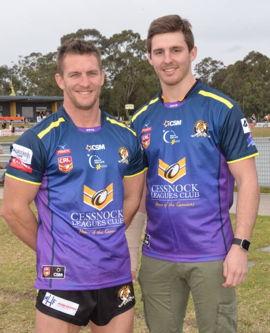 COLOUR CHANGE: Cessnock Goannas players Chris Pyne and Reed Hugo in the purple jersey the Goannas will wear for Saturday's home game.