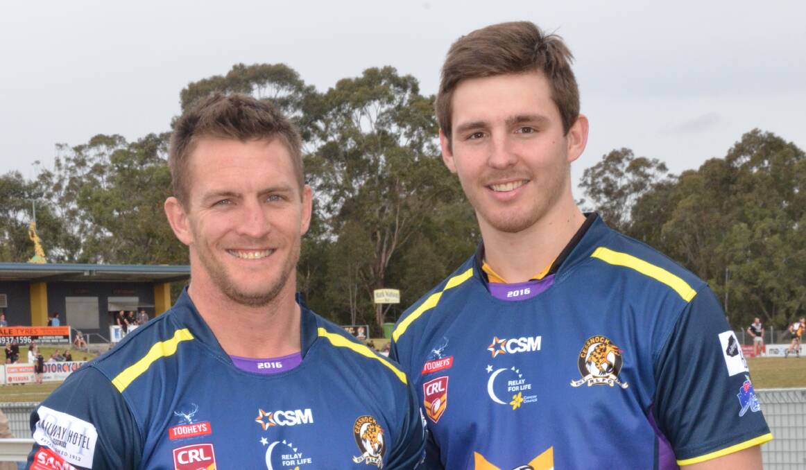 COLOUR CHANGE: Chris Pyne (who will play his 200th game) and Reed Hugo in the purple jersey the Goannas will wear for Saturday's home game to raise funds for Relay For Life.