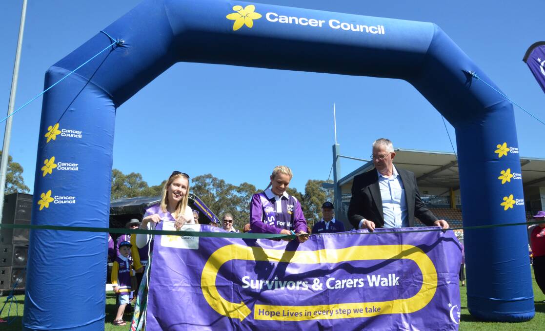 FANTASTIC DAY: Cr Pynsent with Miss Cessnock City Emma Myers and Face of Relay Sophie Stapleford, cutting the ribbon to open the Cessnock Relay For Life on Saturday.