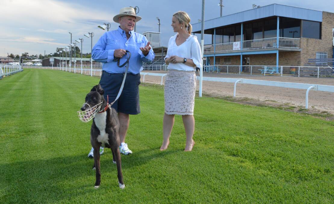 PLANS: Cessnock Greyhound Club vice-president Bob Whitelaw and his greyhound Our Girl with Cessnock councillor Melanie Dagg at the showground.