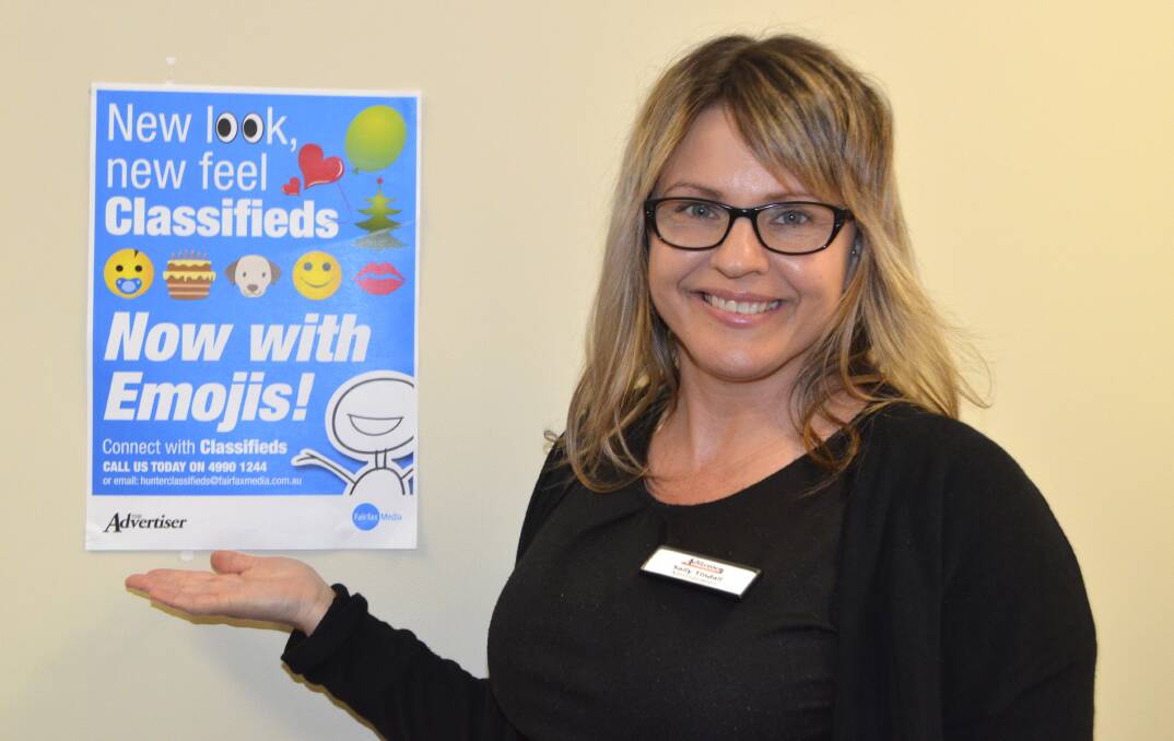 ADDED IMPACT: Advertiser staff member Sally Tindall is happy to help place your new-look classified ad, now in a larger type size and available with emoji symbols.