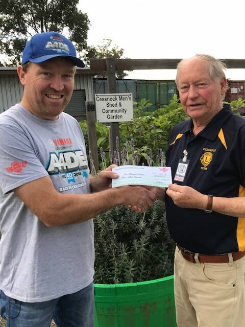 GENEROUS: Cessnock Motorcycle Club president Dave Blake presents Cessnock Men's Shed president and Lions Club treasurer Peter Torenbeek with the cheque.