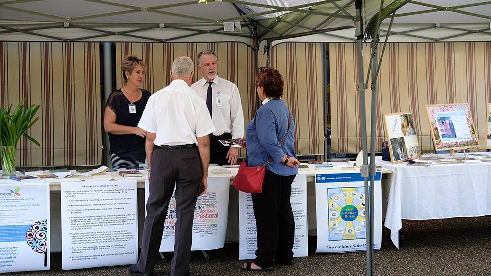 SUPPORT: Calvary Cessnock pastoral care worker Sally Lavis and pastoral care coordinator Andrew Mead discussing the Seasons for Growth program with the local community.