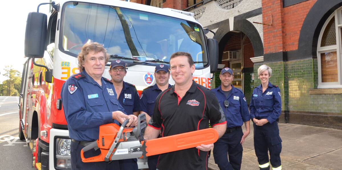 SUPPORT: At front, Abermain Fire Brigade captain Bill Lang receives the new chainsaw from Hotel Denman Abermain publican Jason Crockett, and at back, Abermain firefighters Eddie Gerigk, Jamie Baker, Stephen Croucher and Ashley Gordon. Picture: KRYSTAL SELLARS