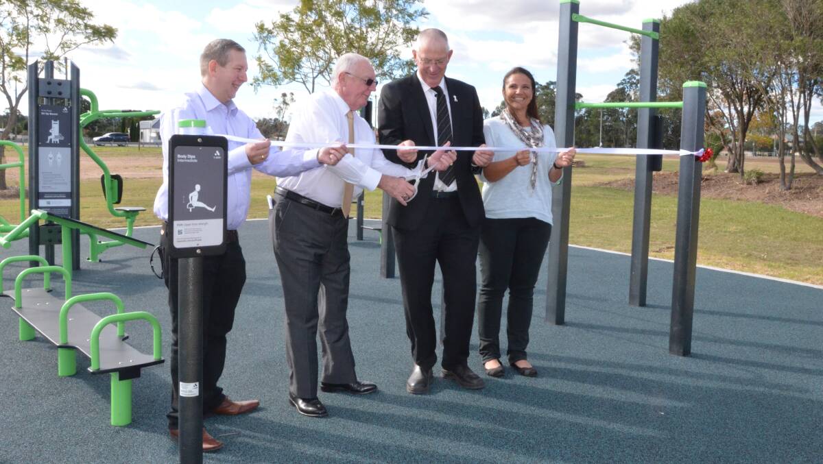 TEAM EFFORT: Coalfields Healthy Heartbeat coordinator Shane Feeney, Newcastle Permanent Charitable Foundation chairman Michael Slater, Cessnock mayor Bob Pynsent and Branxton resident Kate Gray cut the ribbon to declare the Branxton outdoor gym officially open.  Picture: KRYSTAL SELLARS