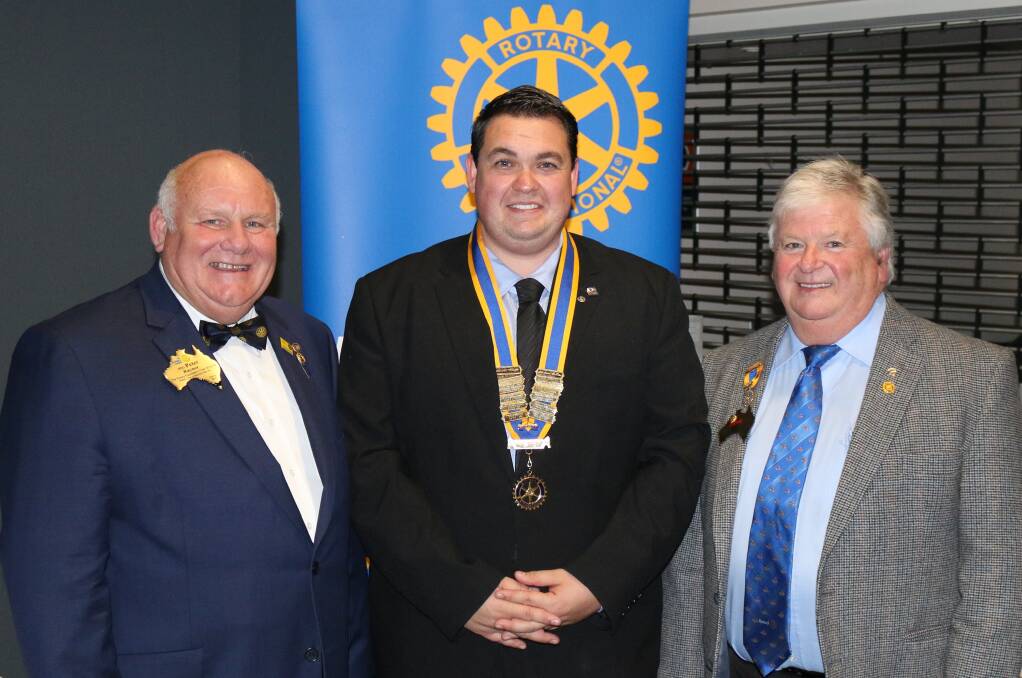 CHANGEOVER: Past District Governor Peter Raynor, Kurri Rotary Club president Anthony Burke and Past District Governor Greg Bevan at the club's changeover on June 28. Picture: CLINT EKERT