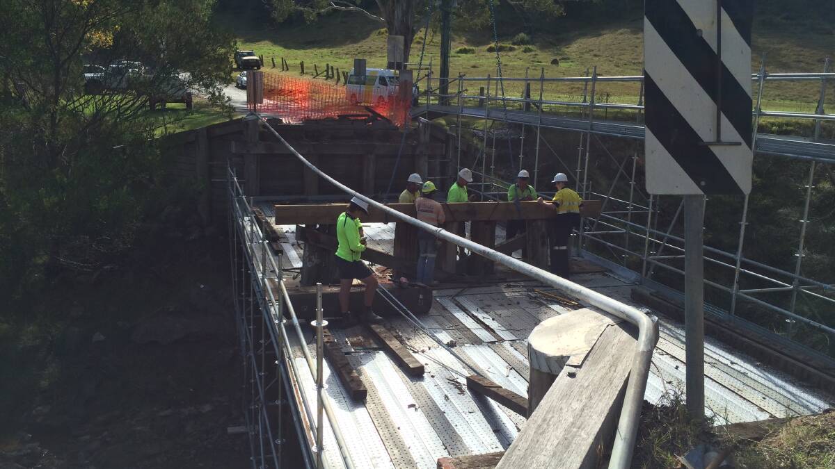 CONSTRUCTION: Council crews working on the Cedar Creek Bridge, which has now re-opened to traffic.
