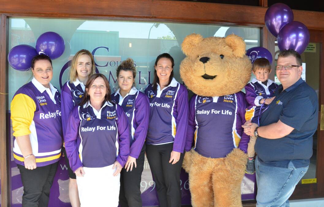 SUPPORTERS: Coutts Mallik Rees Solicitors and Conveyancers staff Toni Ralston, Alex Seath, Debbie Hicks, Brooke Courtney and Marlie Caban, Relay For Life mascot Dougal Bear, Kyan Burke and relay chairperson Clint Ekert at the pre-Relay promotion 'Purple Day' in Vincent Street on Tuesday. Picture: KRYSTAL SELLARS