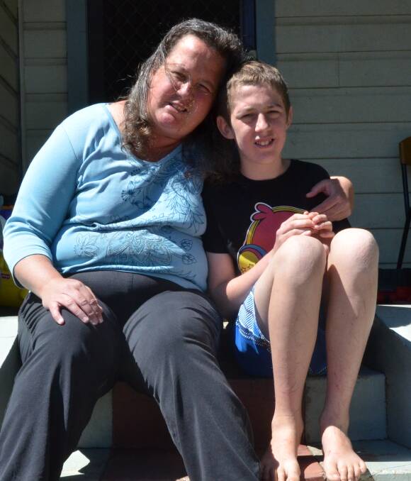 HOME SAFE: Belinda Pagett with her son Stephen Otte, who got lost in the bush near Poppethead Park, Kitchener on Saturday morning.