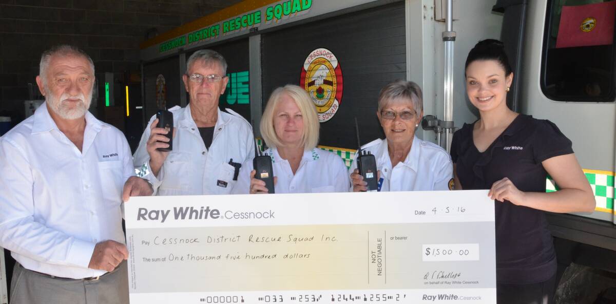 DONATION: Ray White Cessnock principal Kevin Phillips and sales assistant Prue Avery with rescue squad volunteers Trevor Milgate, Mandy Madgwick and Vicki West.