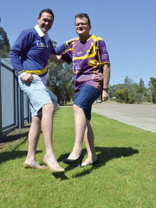 CHALLENGE: Anthony Burke and Clint Ekert will walk one lap of Baddeley Park in heels for $100 that is donated to their Cessnock Relay For Life fundraising page by 4pm Sunday.
