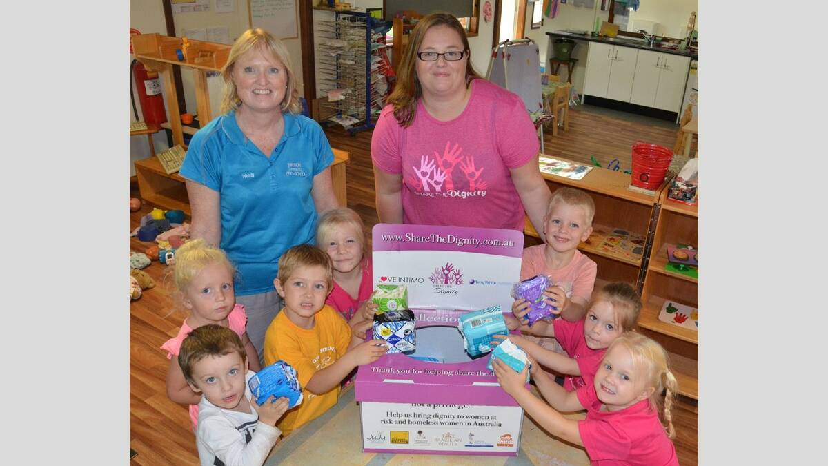 ESSENTIALS: Weston Community Preschool director Wendy Comyns and president Samantha Tama and students Lakyn, Scarlett, Rylan, Kayla, Odin, Chelsea and Arrabella with some of the items that will be donated to Share the Dignity. Picture: Krystal Sellars