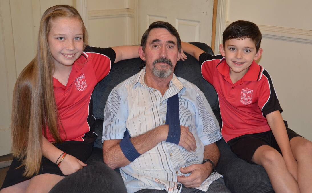 TOUGH TIME: Paxton man Larry Greentree suffered a stroke in April. He is pictured with grandchildren Montanna and Eathan, who will cut their hair off to help raise money for their Pop at Paxton Hotel on September 24.